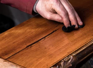 hand-sanding-vintage-antique-wooden-cabinet-los-angeles-ca